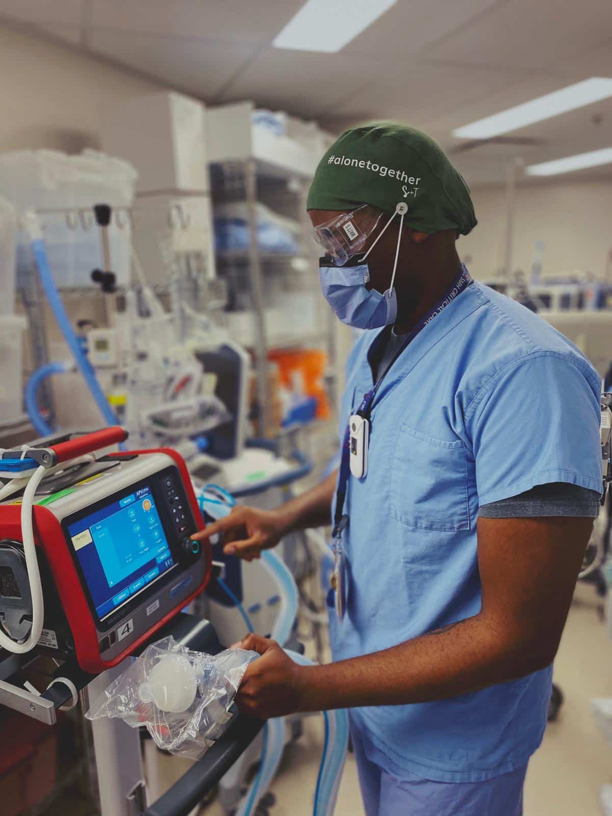 Respiratory therapist working on machine