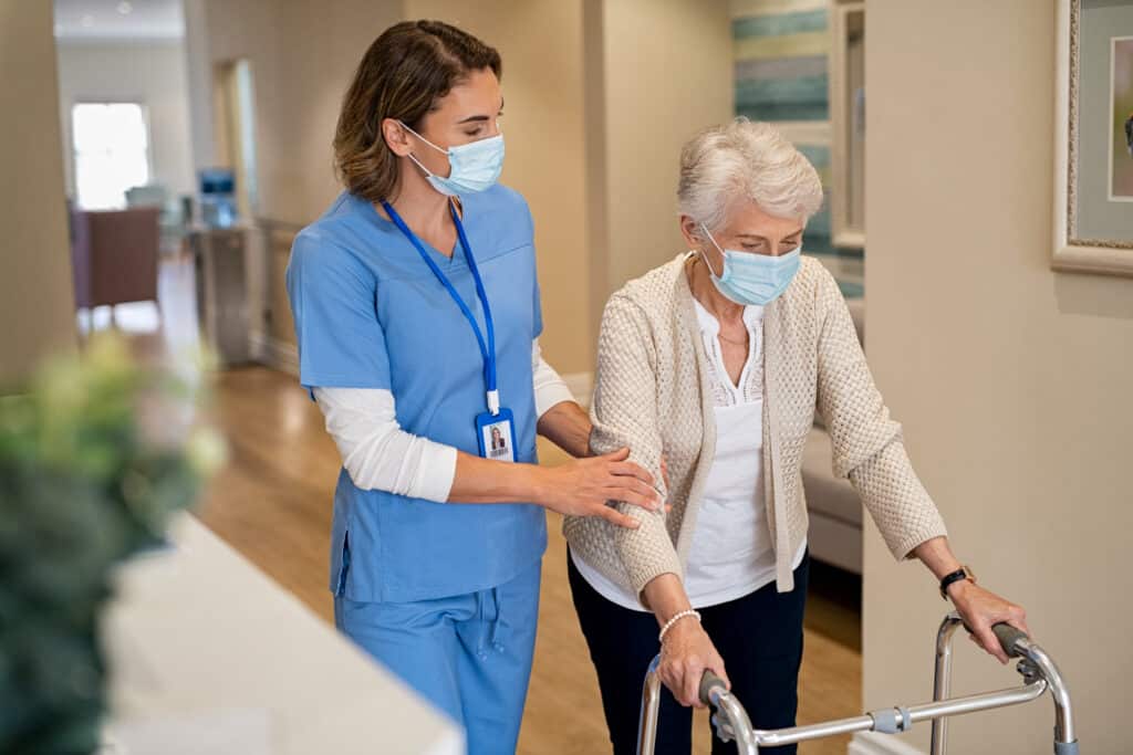 New graduate nurse with patient