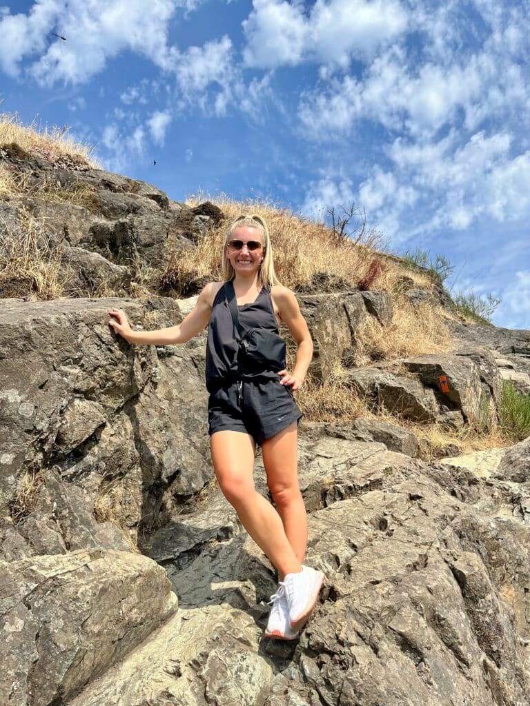 Woman hiking rock face