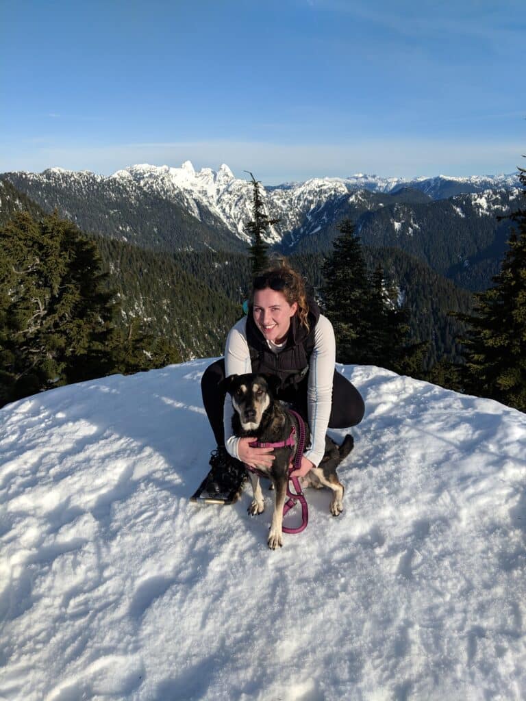 Lady standing on snowy mountain