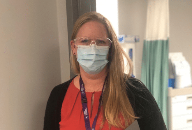 RN wearing PPE mask and glasses.