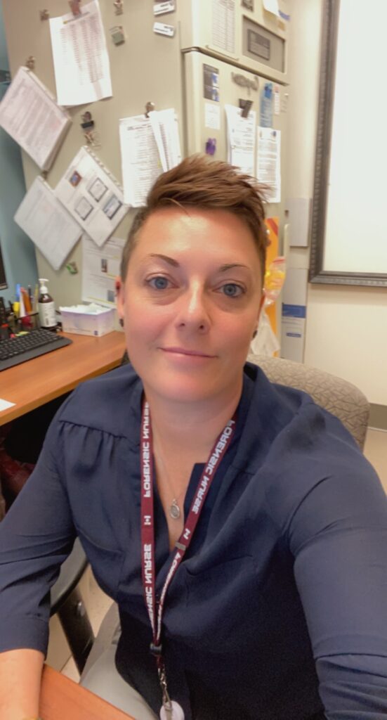 Forensic nurse posing in an office.