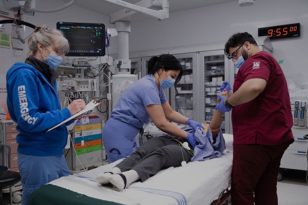 Nurses working on patient at Fraser Health.