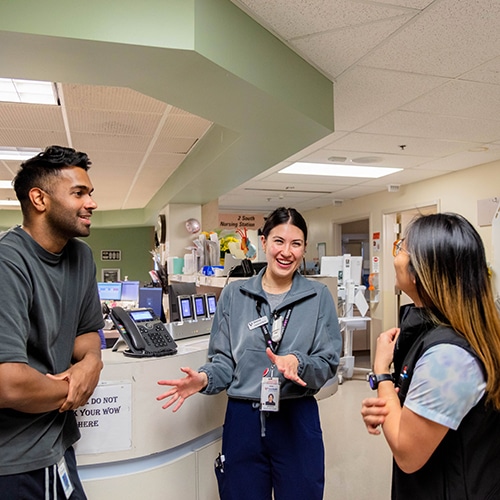 Staff at Fraser health chatting.