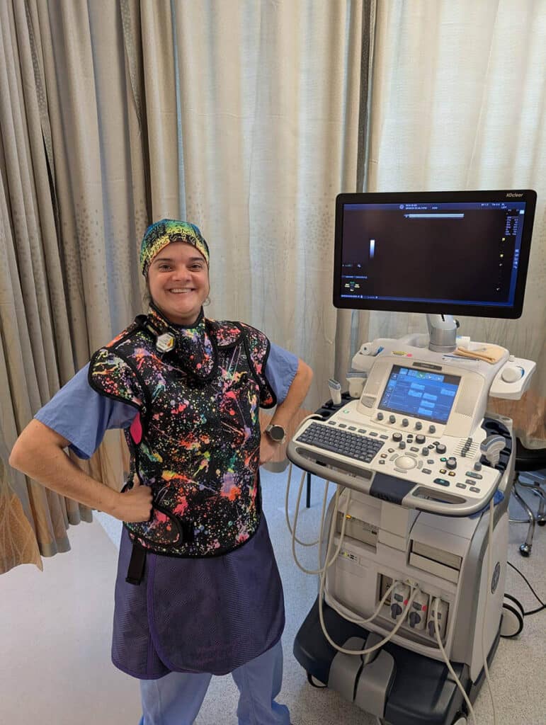 Interventional radiology nurse posing with equipment