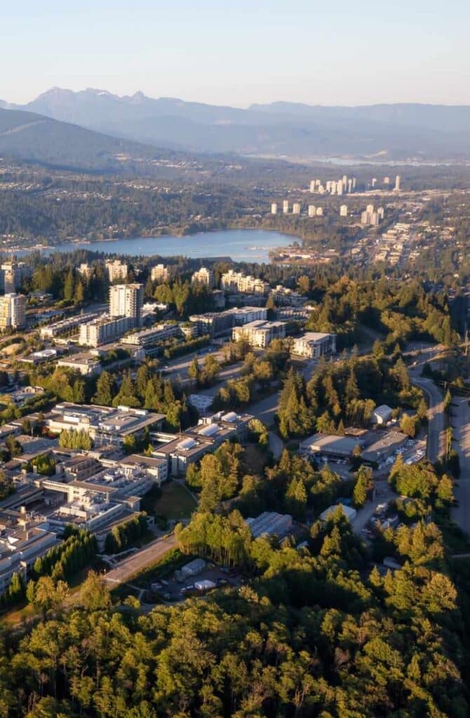 Aerial view of mountain range, Burrard Inlet and Simon Fraser University, SFU, on Burnaby Mountain in Burnaby, B.C., Canada