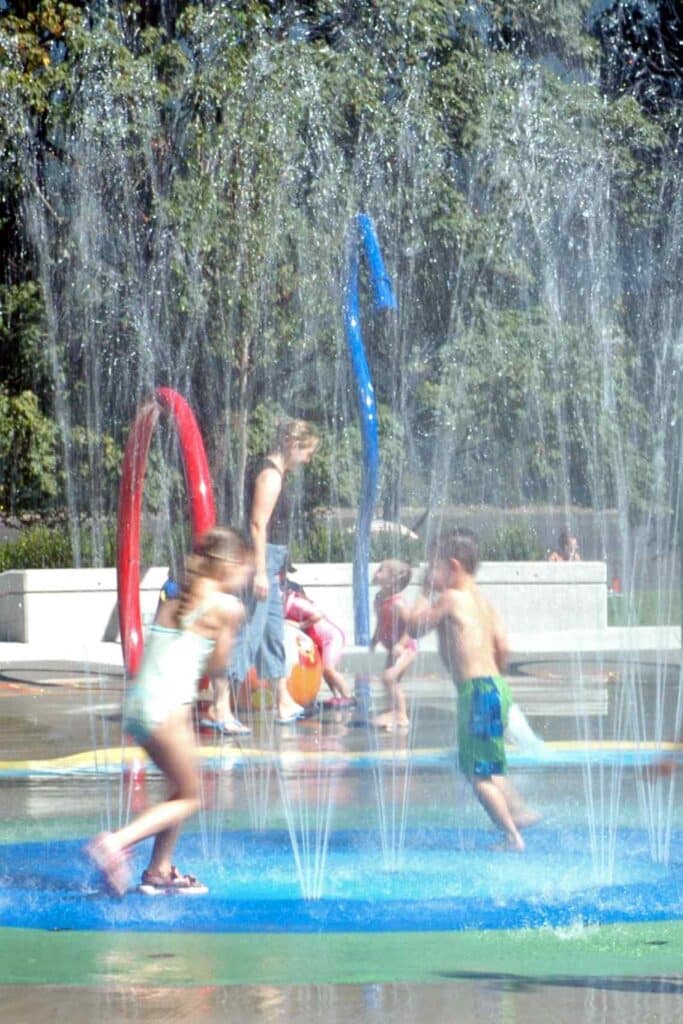 Kids playing in water park.