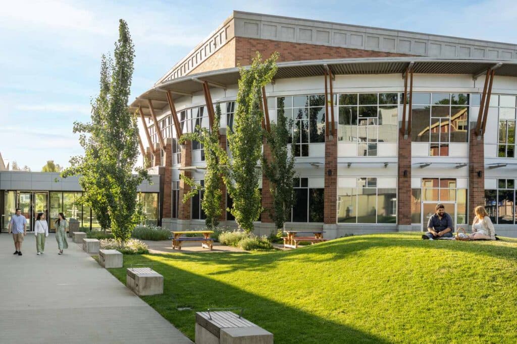 Couple on grassy knoll in Surrey.
