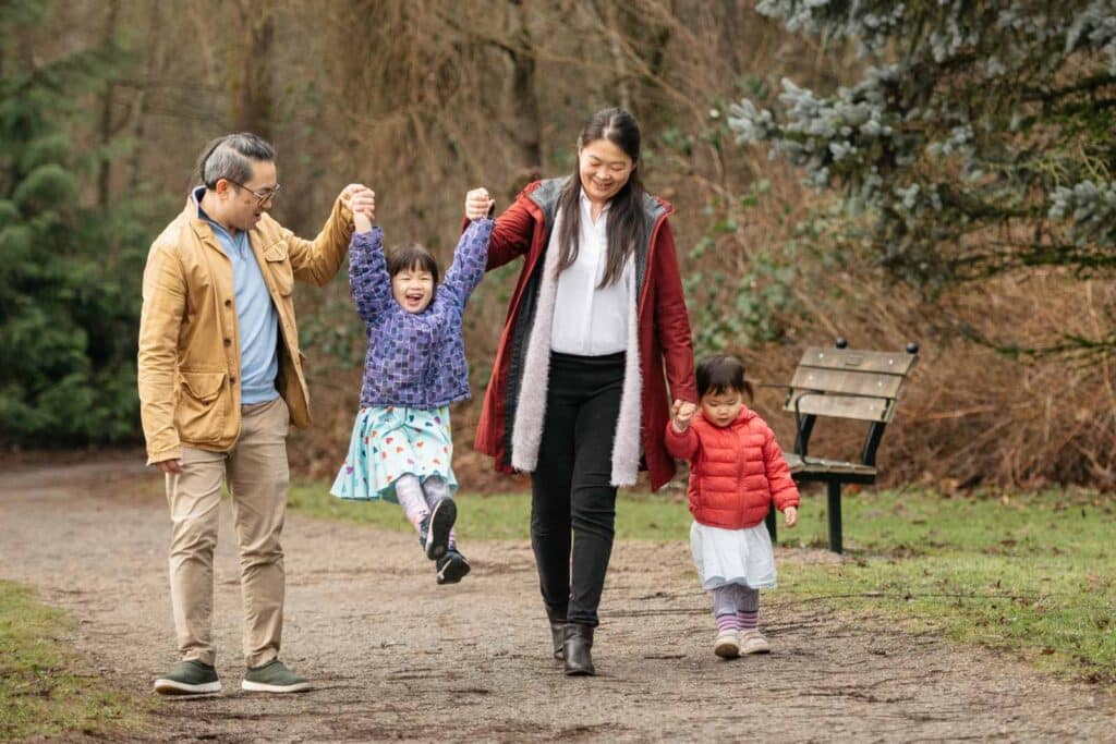 Family walking on gravel path in Surrey.