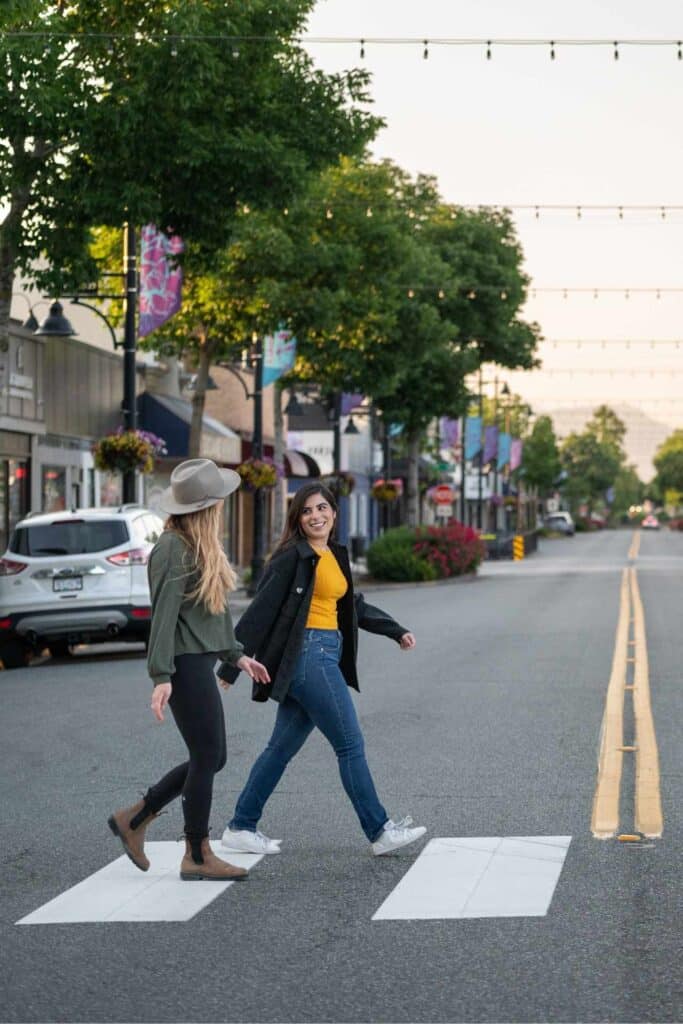 People walking across crosswalk in Surrey.