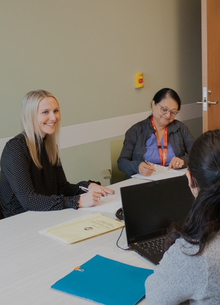 Fraser Health staff at table.