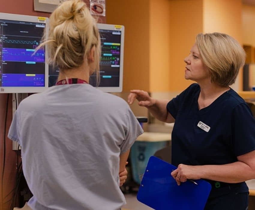 Physician looking at screen.